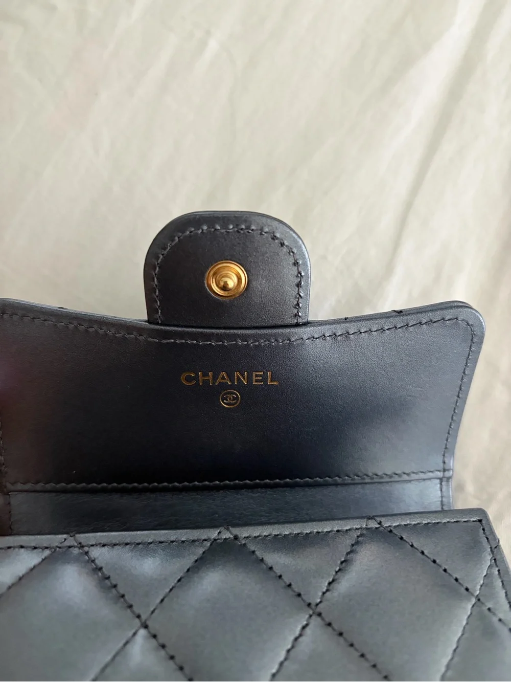 CHANEL Black Quilted Leather Wallet with Gold CC Emblem